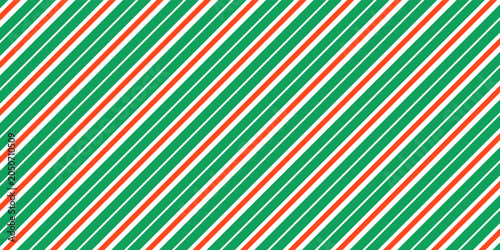Christmas seamless pattern. Red and green diagonal stripes background. Candy cane repeating decoration wallpaper. Winter holiday lines backdrop. vector See Less