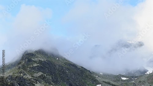 Schwarzhorn wrapped by fogs, Pizzo Suretta landscape in the Montespluga range