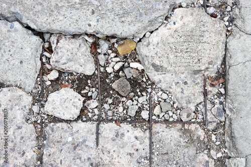 Broken and damaged concrete road background