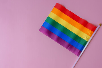 Flag for Pride Month on a light pink background