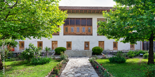Palace of Shaki Khans, Shaki, Azerbaijan. Historic 18th century palace featuring traditional shebeke windows, a lush garden, and a winding stone path