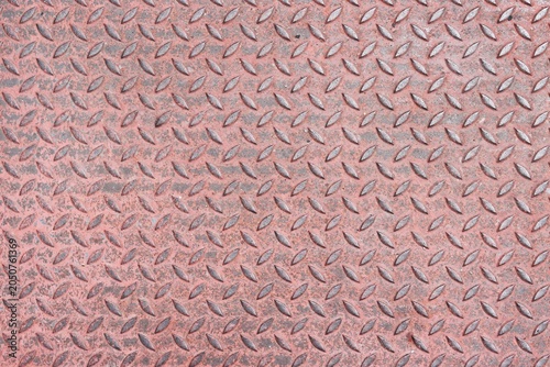 Old and rusty red steel diamond plate pattern background