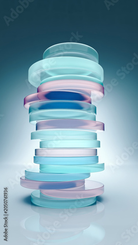 Stacked translucent glass or plastic discs with smooth edges, arranged in a vertical tower, illuminated by soft light creating a gradient background.