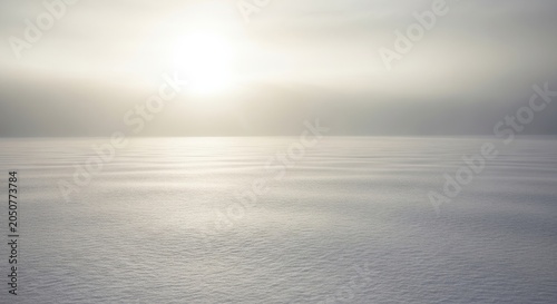 Expansive Snow Field Reflecting Soft Sunlight