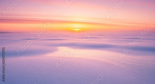 Snow field reflecting soft sunrise with vibrant sky