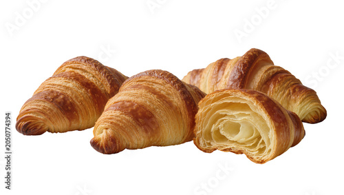 Fotografie Golden brown croissants with flaky layers, one cut in half