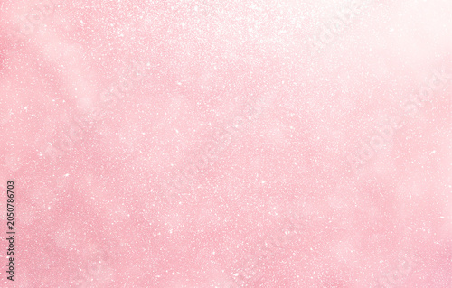 Abstract blurred shiny pink background, blank pink background with glitter pattern