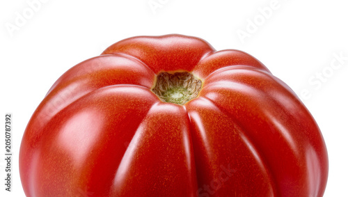 Bild auf Leinwand Ripe red heirloom tomato with deep lobes and green stem