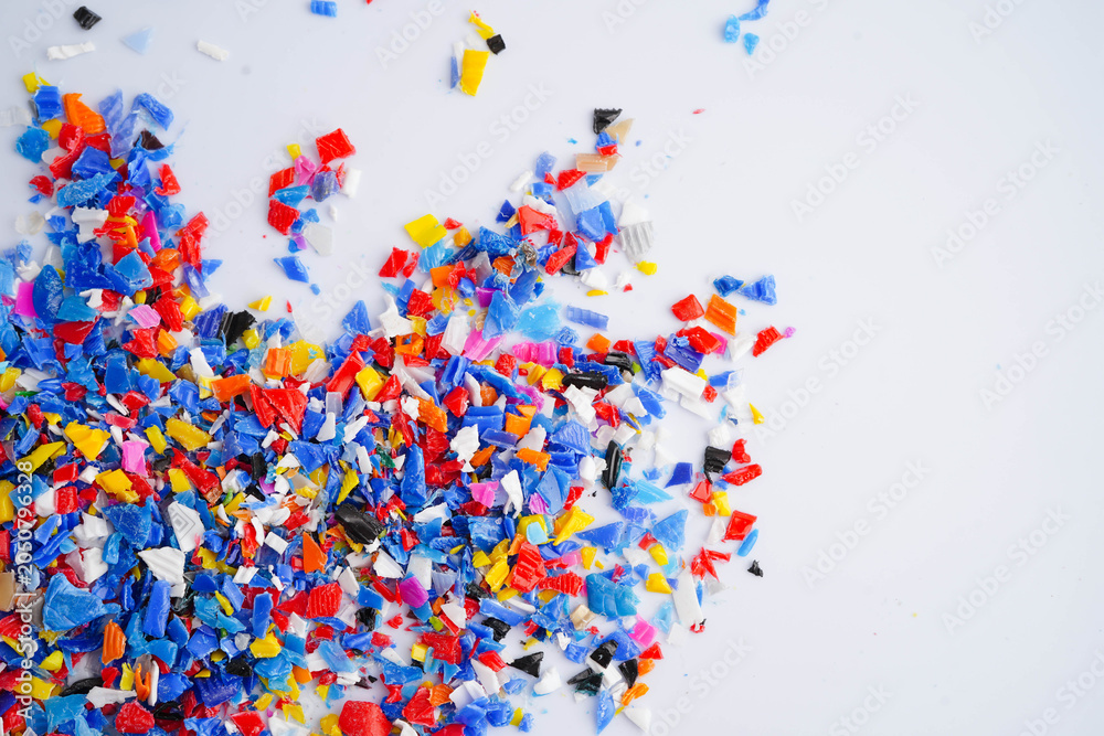 Fototapeta premium Plastic colorful pieces recycling shredded for industrial use.