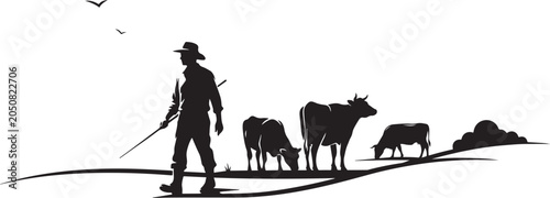 Cowboy walking with cattle on hillside cows herd