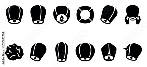 Collection of black silhouette sky lanterns in various shapes and orientations, isolated on a clean white background