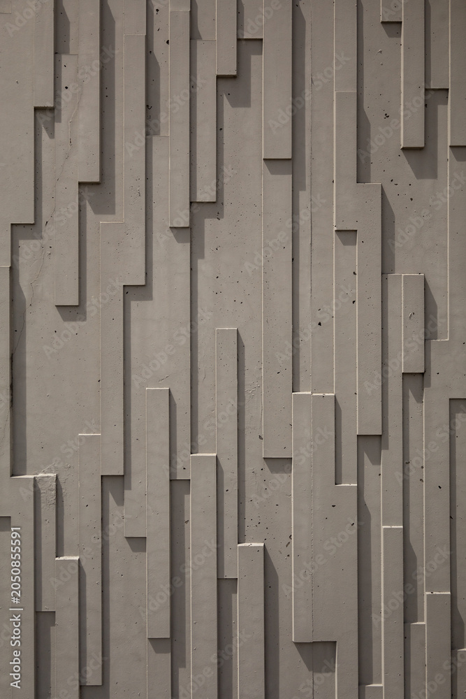 Fototapeta premium Vertical Abstract Concrete Wall Texture with Modern Geometric Architectural Pattern