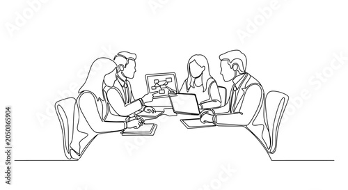 Team collaborating on a digital project around a conference table with laptops and presentation screens