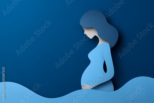 Pregnant woman silhouette in blue paper cut style, gently cradling her belly, surrounded by flowing waves, representing motherhood and serenity in a creative illustration