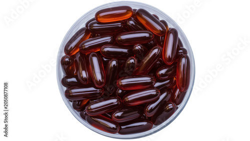 Photos Amber colored softgel capsules in clear glass jar
