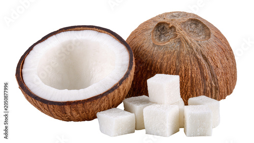 Tableau sur toile Whole and halved coconut with cubes of white sugar
