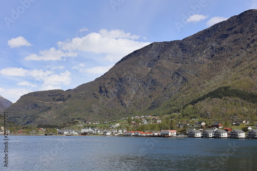 A view of the buildings lining the waterfront of Skjolden.  Skjolden is a Norwegian village at the inner most point of the Lustrafjorden a branch of the world's longest fjord, Sognefjorden.
