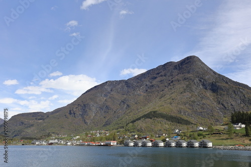 A view of the buildings lining the waterfront of Skjolden.  Skjolden is a Norwegian village at the inner most point of the Lustrafjorden a branch of the world's longest fjord, Sognefjorden.