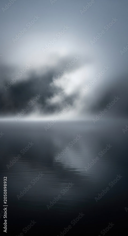 Obraz premium Atmospheric Landscape - Serene Fog Over Still Water Creates Dramatic Scene.