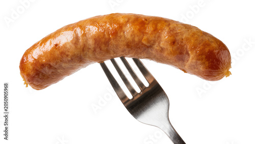 Cooked sausage on metal fork