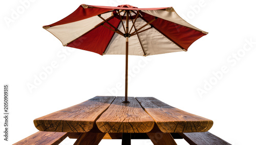 Cuadro en lienzo Red and white striped patio umbrella over wooden picnic table