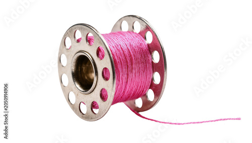 Metal bobbin with pink thread and loose end