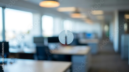 Blurred modern office interior viewed through glass door with contemporary workplace and copy space