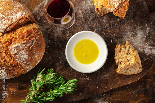 Homemade artisan sourdough bread loaf on a rustic wooden cutting board