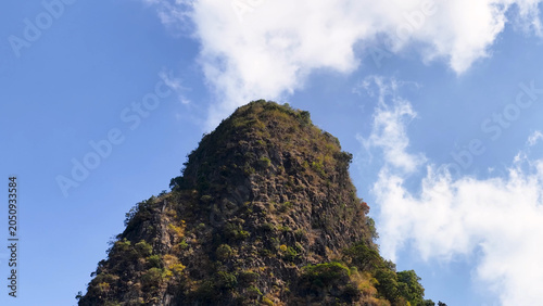 Bild auf Leinwand Rugged Limestone Karst Mountain Peak Under Blue Sky in Krabi