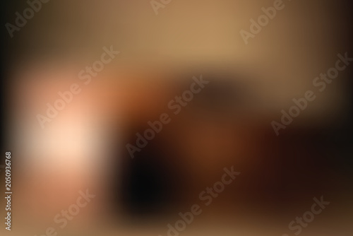 A blurred image of a person sitting on a couch in a living room with a transparent background effect.