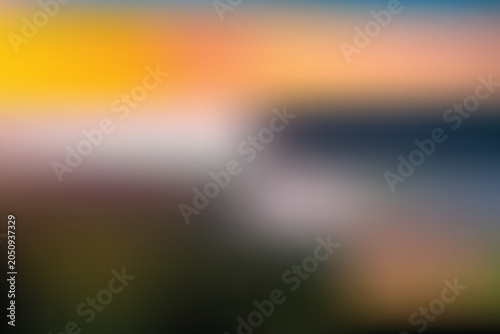 A serene landscape of rolling hills and sky at sunset