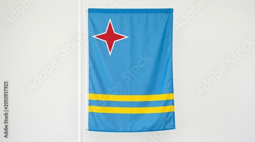National flag of Aruba with light blue field, yellow stripes, and red star outlined in white, design symbolizes sea, sky, abundance, heritage, and island identity.
