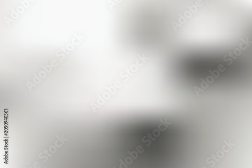 A close-up view of blurred black and white objects on a transparent background