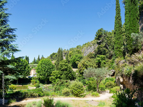 The wooded park of Villecroze-les-Grottes in the Haut-Var region is nestled in a cirque surrounded by a cliff from which a magnificent waterfall cascades
