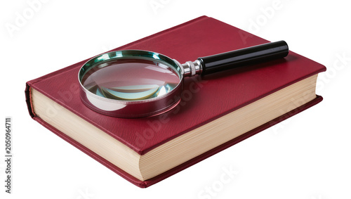 Tableau sur toile Magnifying glass on closed red hardcover book