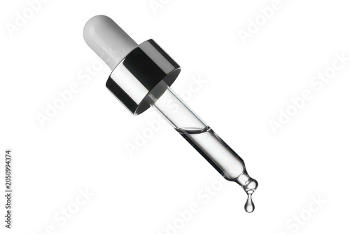 A clear glass dropper pipette with a white rubber bulb and silver collar, releasing a single liquid drop, isolated on a black background