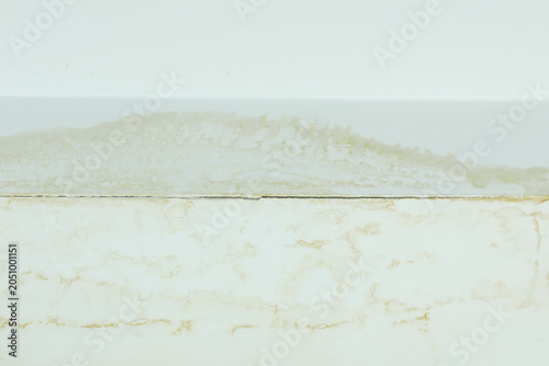damaged ceiling with severe water stains, mold, and cracks caused by rain leaking through the roof. The image shows moisture damage and fungus growth from a ceiling leak problem water leaking ceiling