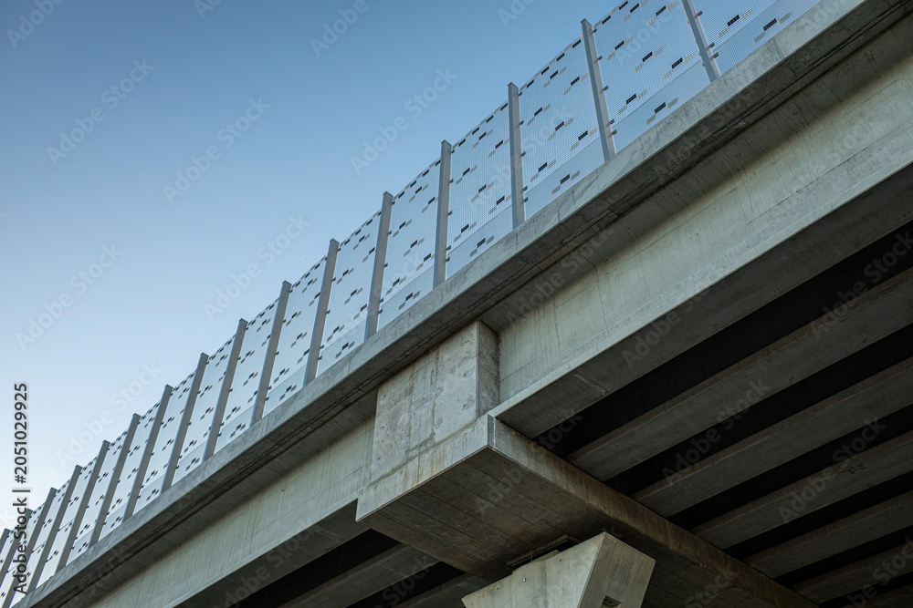 Fototapeta premium Highway bridge with concrete structure and transparent noise barrier