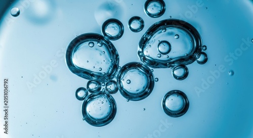 Macro bubbles in blue liquid background.