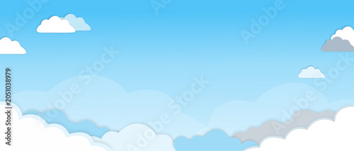 Photos A serene illustration of a clear blue sky filled with soft, fluffy white and grey clouds