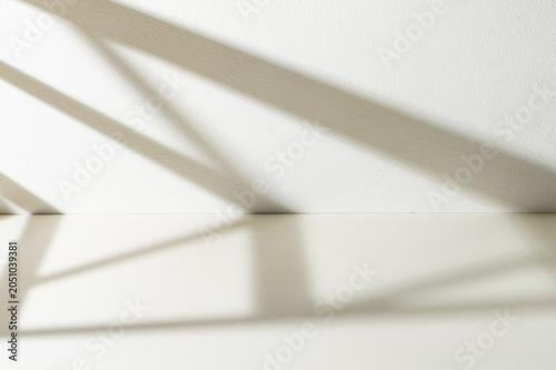 Window shadows cast on yellow background.