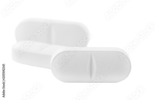 White pills. Medical background of many capsule tablets and pills