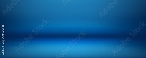 Foto Blue studio room background with spotlight illumination