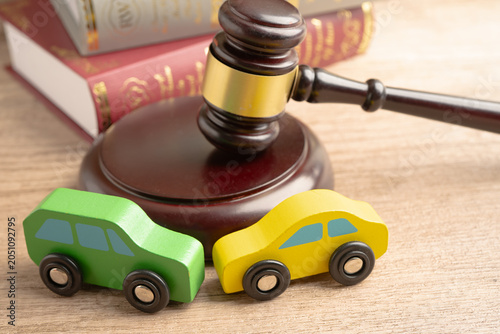 Billede på lærred Car accident lawsuit and insurance, Judge hammer with car model.