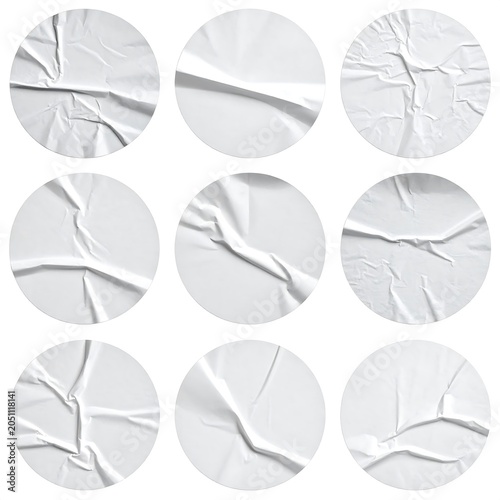 A collection of 9 circular images of crumpled white paper textures on a plain background