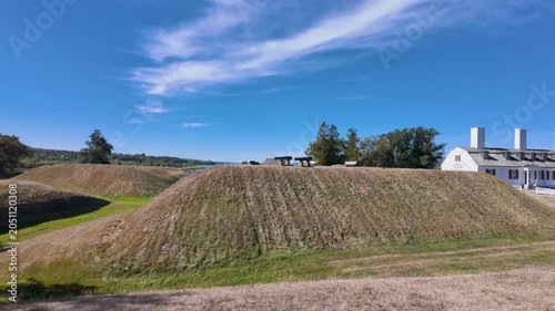 Slow motion footage of Fort Anne National Historic Site in Annapolis Royal Nova Scotia Canada featuring preserved earthwork ramparts historic military buildings and defensive cannons