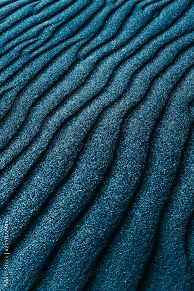 Fototapeta premium Abstract Blue Sand Ripples And Textured Dune Pattern Closeup Showing Wind-Sculpted Lines And Calm