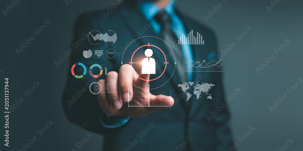 Fototapeta premium Businessman working with virtual screen and analyzing sales data. target customer concept. business global internet connection application technology and digital marketing.