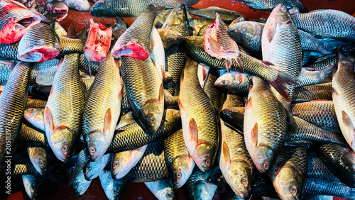 Canvastavla Fresh raw fish for sale at a local market in india, closeup view of a pile of fr
