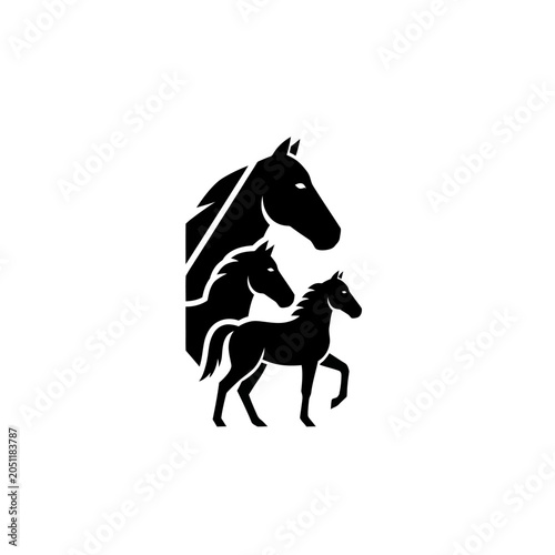 Silhouette of three horses in black and white, showing different sizes and poses